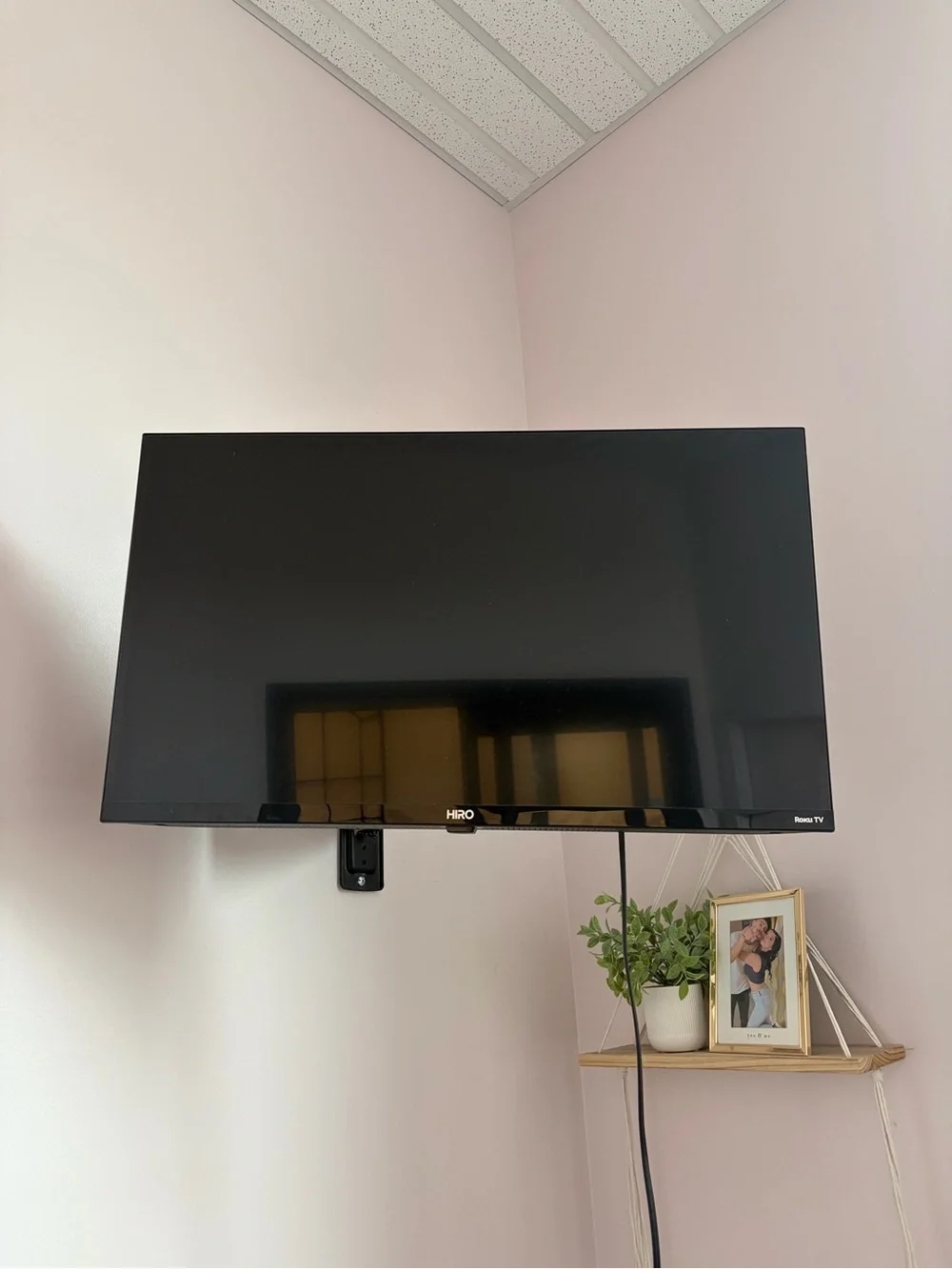 IRO Black Wall-Mounted TV with Glossy Black Finish